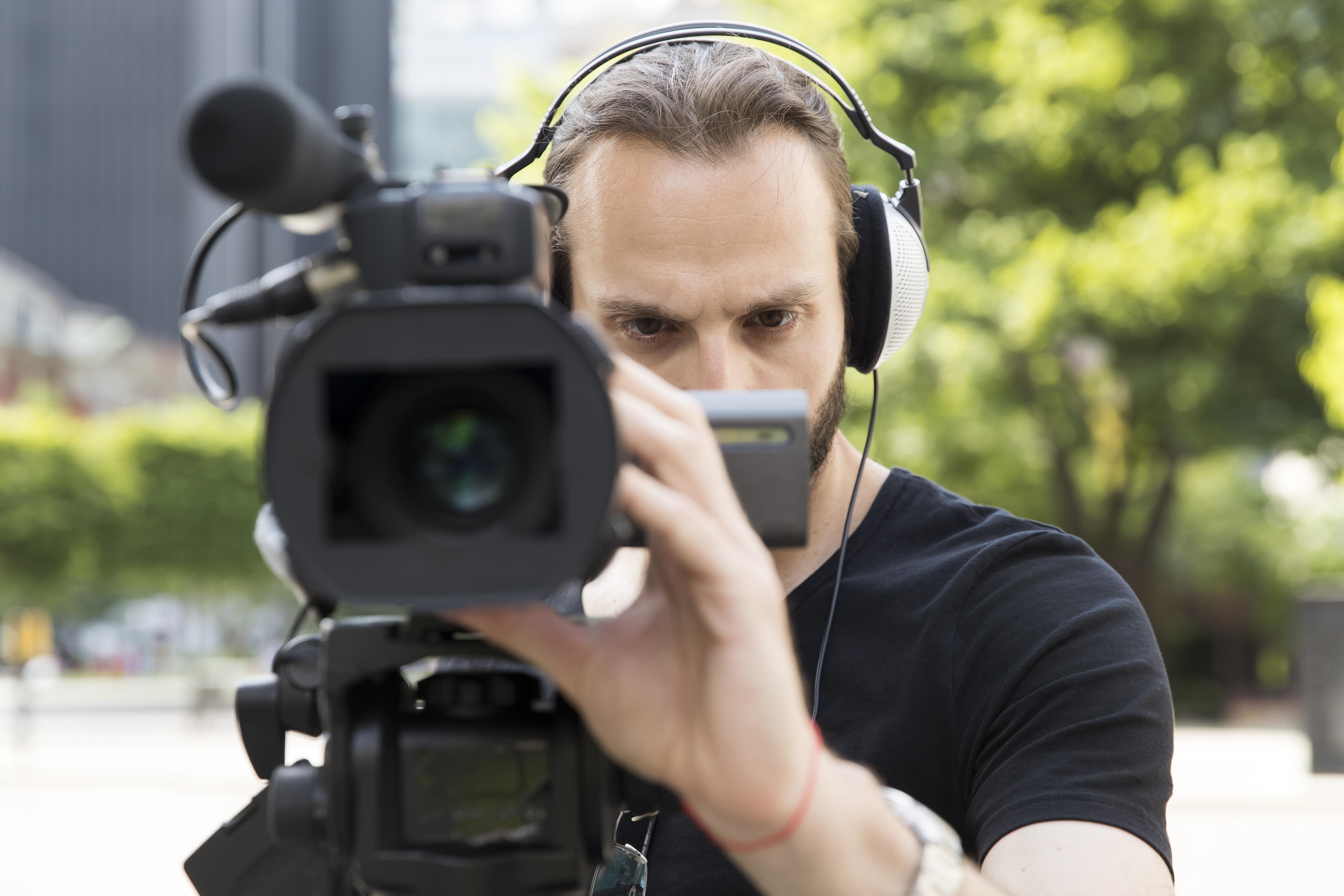 close up cameraman doing his job